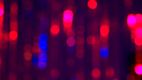 Defocused-Close-Up-Shot-Of-Sparkling-Tinsel-Curtain-In-Night-Club-Or-Disco-With-Flashing-Strobe-Lighting